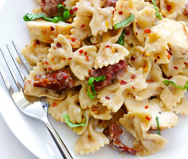 Plate full of creamy chicken and sundried tomato pasta